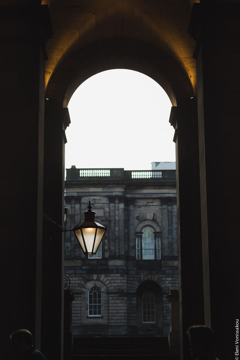 Butternut Squash Soup with Chilli and Whipped Goat’s Yoghurt Feta www.thefoodiecorner.gr Photo description: A dark view through an archway looking into a courtyard with old university buildings.