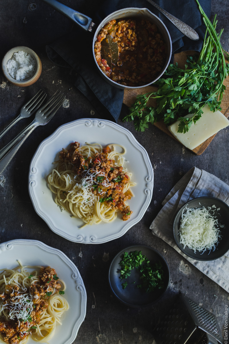 Slow Cooker Turkey Meat Sauce for Pasta (from scratch) www.thefoodiecorner.gr Photo description: A similar set up to the main photo, with two plates of spaghetti with sauce on top.