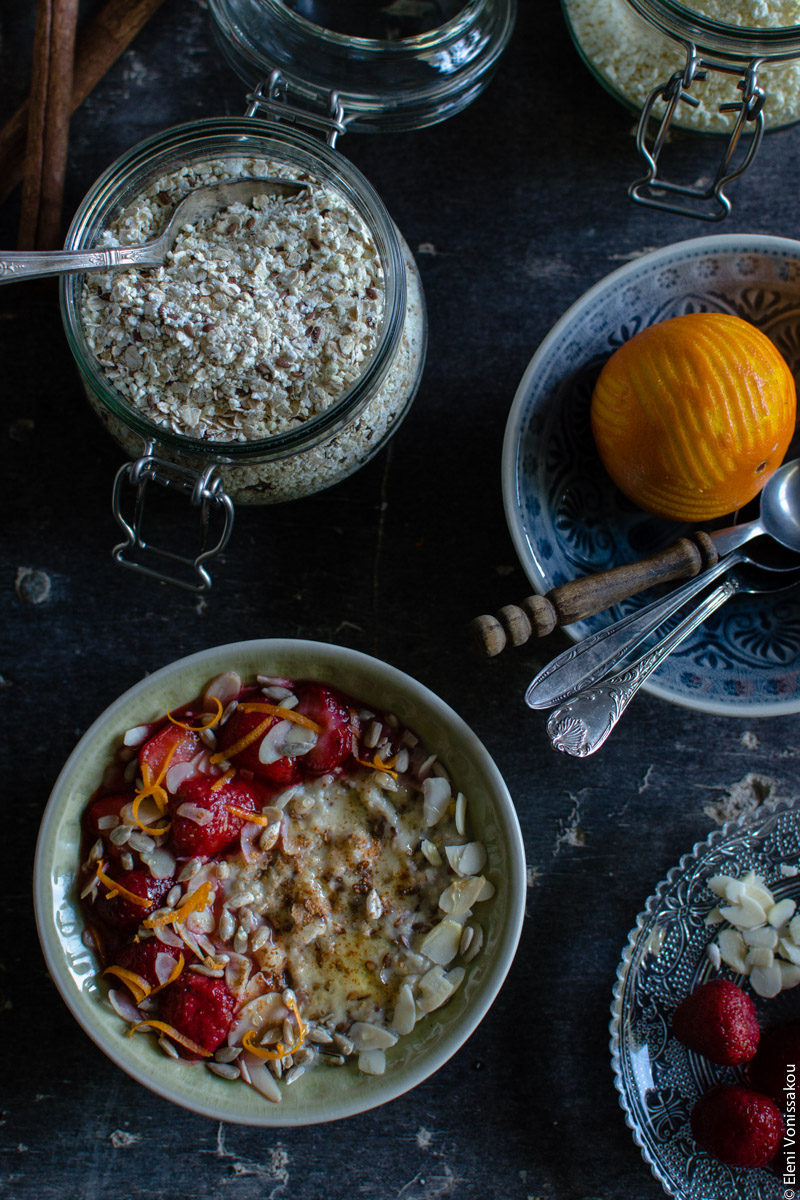 Oat Mix for Instant, Creamy Microwave Porridge (Oatmeal) www.thefoodiecorner.gr Photo description: The bowl of porridge in the bottom left corner, the jar of oat mix just above it, and the empy bowl with the orange in it half visible to the right.