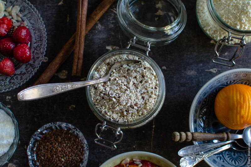 Oat Mix for Instant, Creamy Microwave Porridge (Oatmeal) www.thefoodiecorner.gr Photo description: A close up, overhead view of the jar of oat mix with a spoon sticking out.