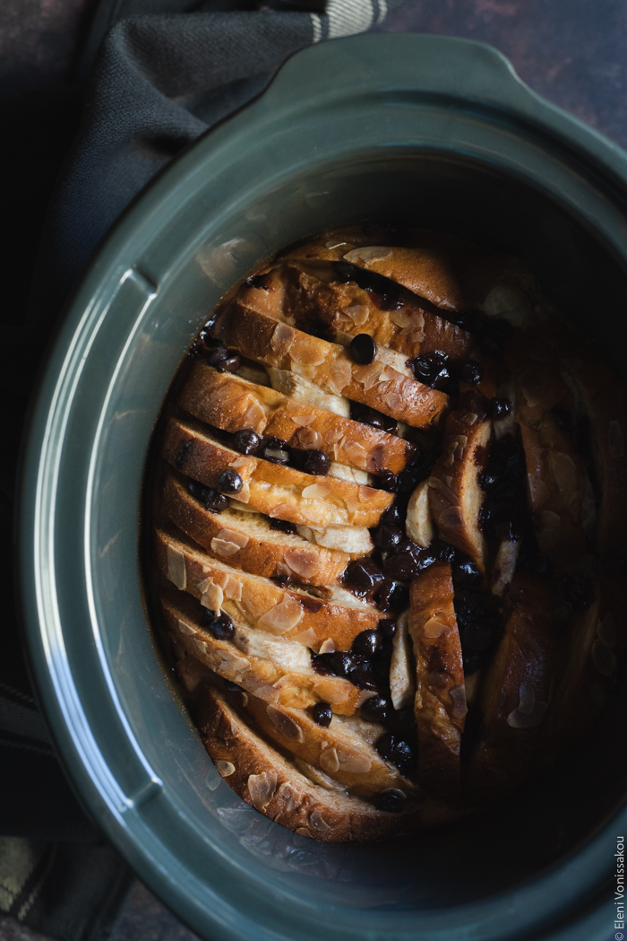 Slow Cooker Sweet-Bread Pudding with Banana, Peanut Butter and Chocolate Chips www.thefoodiecorner.gr Photo description: A view of the cooked pudding in the pot from above.