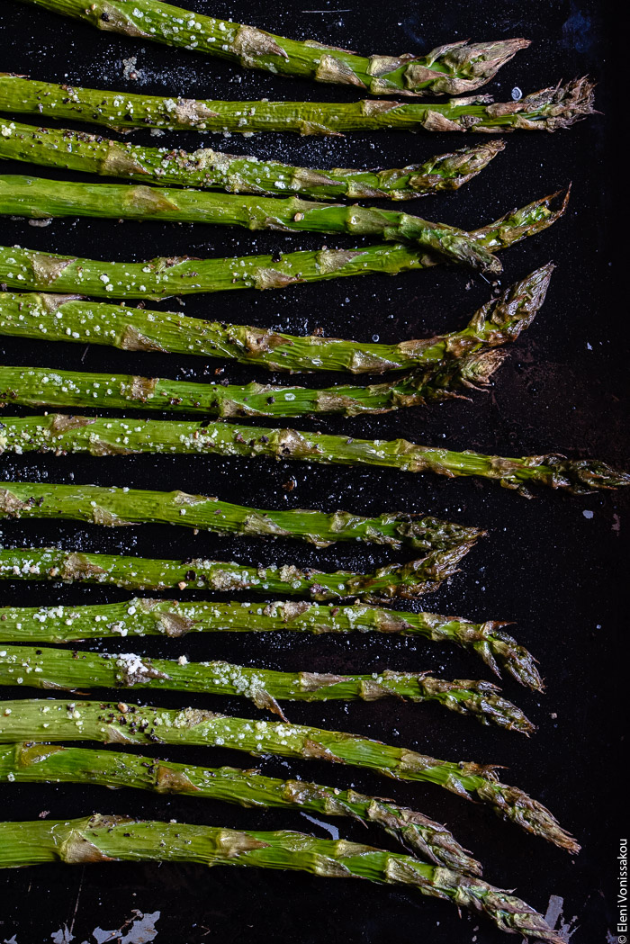 Green Salad with Buckwheat, Beluga Lentils, Roasted Asparagus and Avocado Dressing www.thefoodiecorner.gr Photo description: A very close view of some roasted asparagus tips on an old baking tray.