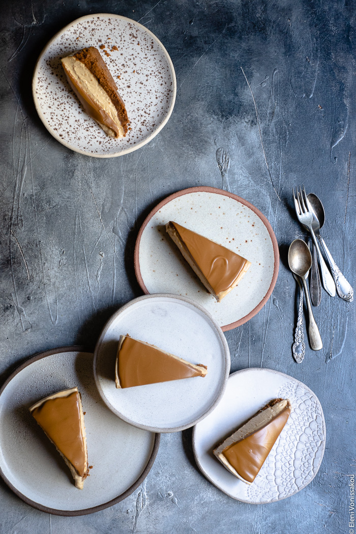 Easy Speculoos Cheesecake www.thefoodiecorner.gr Photo description: five ceramic plates each with a piece of cheescake on it. One plate is stacked on some of the others forming a small cluster.