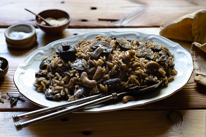 Plant-Based Slow Cooker Balsamic Mushroom Orzotto with Cashews and Sage www.thefoodiecorner.gr photo description: A close, side view of a large platter with balsamic mushroom orzotto. 