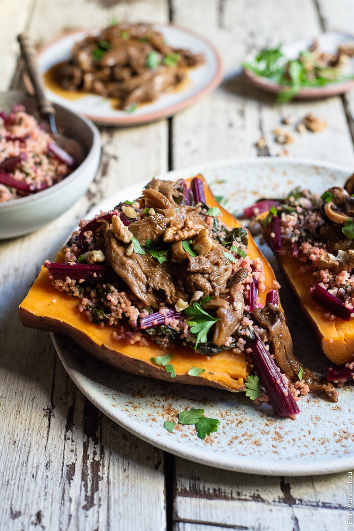 Slow Cooker BBQ Pulled Oyster Mushrooms over Beet Greens Millet and Sweet Potato www.thefoodiecorner.gr Photo description: A close view of a sweet potato loaded with beet greens millet and topped with pulled mushrooms. In the background is a small bowl of millet and a plate of pulled mushrooms. 