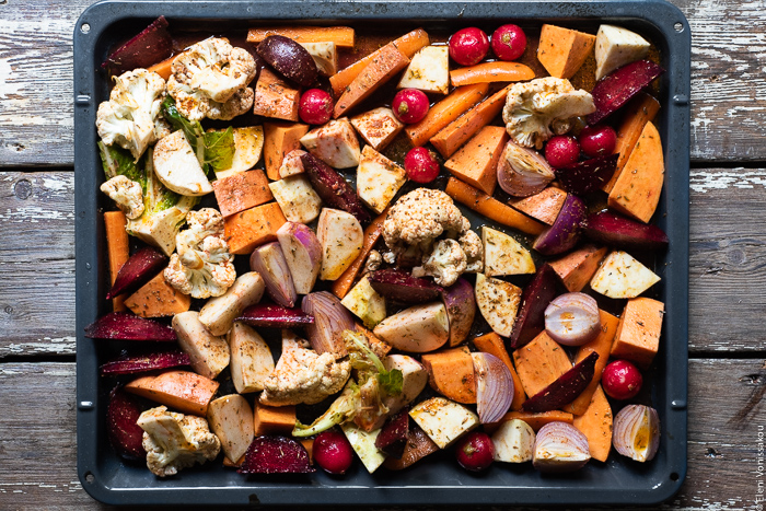 Cumin Roasted Root Vegetable Medley. My Winter “Briam”. www.thefoodiecorner.gr Photo description: Raw, chopped root vegetables and cauliflower spread out on a baking dish ready to be roasted.