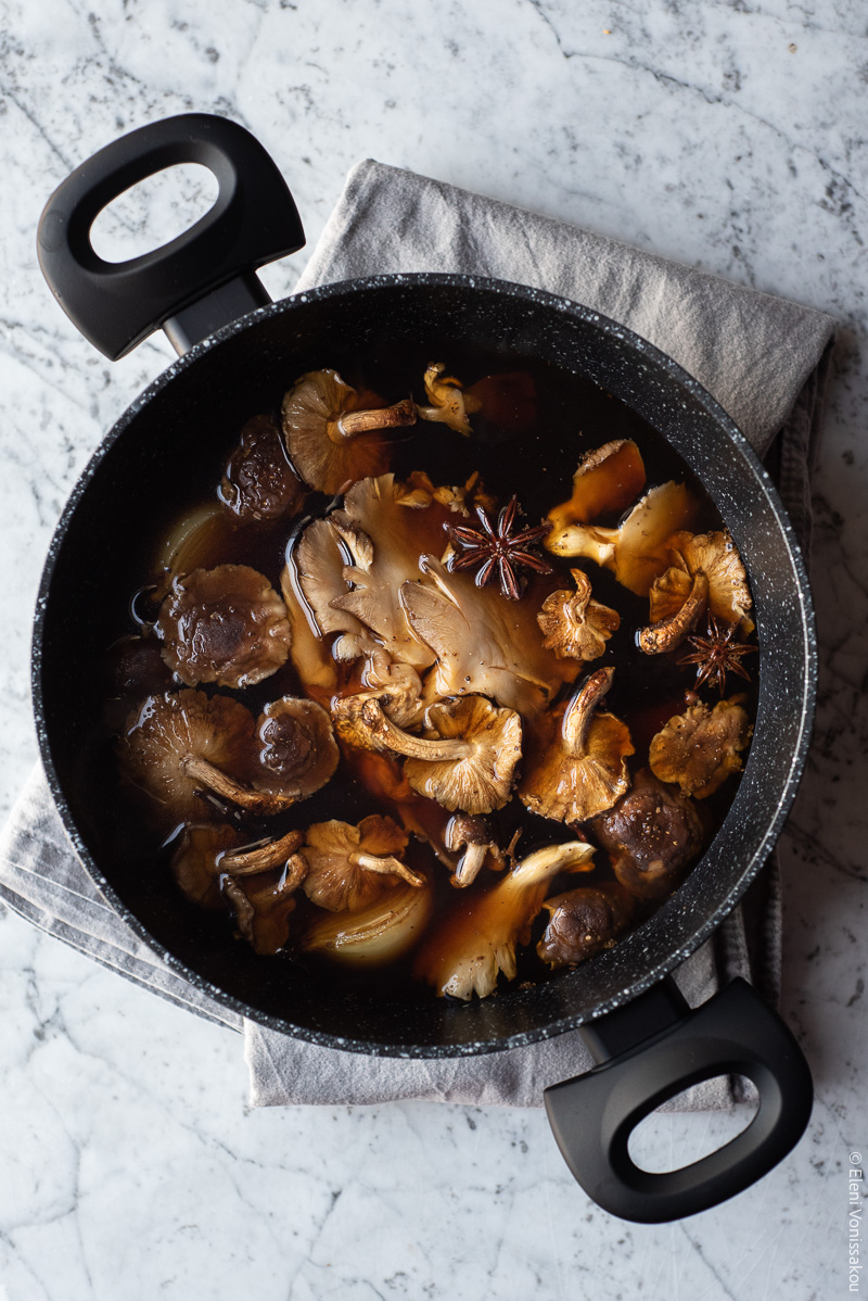 Mushroom Soup with Stelline Pasta, Inspired by Vietnamese Pho www.thefooodiecorner.gr Photo description: Mushrooms and other soup ingredients in a dark liquid inside the saucepan.